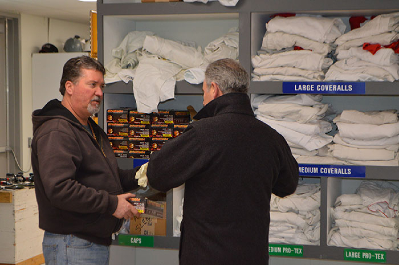 Donny Lapierre, nuclear chemical operator with Washington River Protection Solutions (WRPS), left, shows John Eschenberg, WRPS manager, improvements at a Hanford Site tank farm employee change trailer.