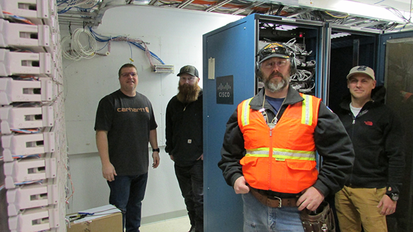 Robin Maples, Zack Larson, Joe Jensen, and Quinn Bragg with Mission Support Alliance were among the technicians who replaced access layer switches throughout the Hanford Site.