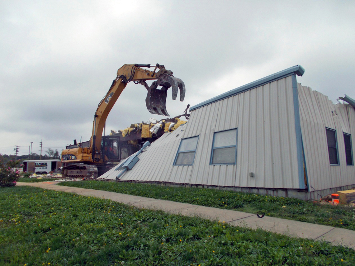 A building is demolished at the Weldon Spring, Missouri, Site.