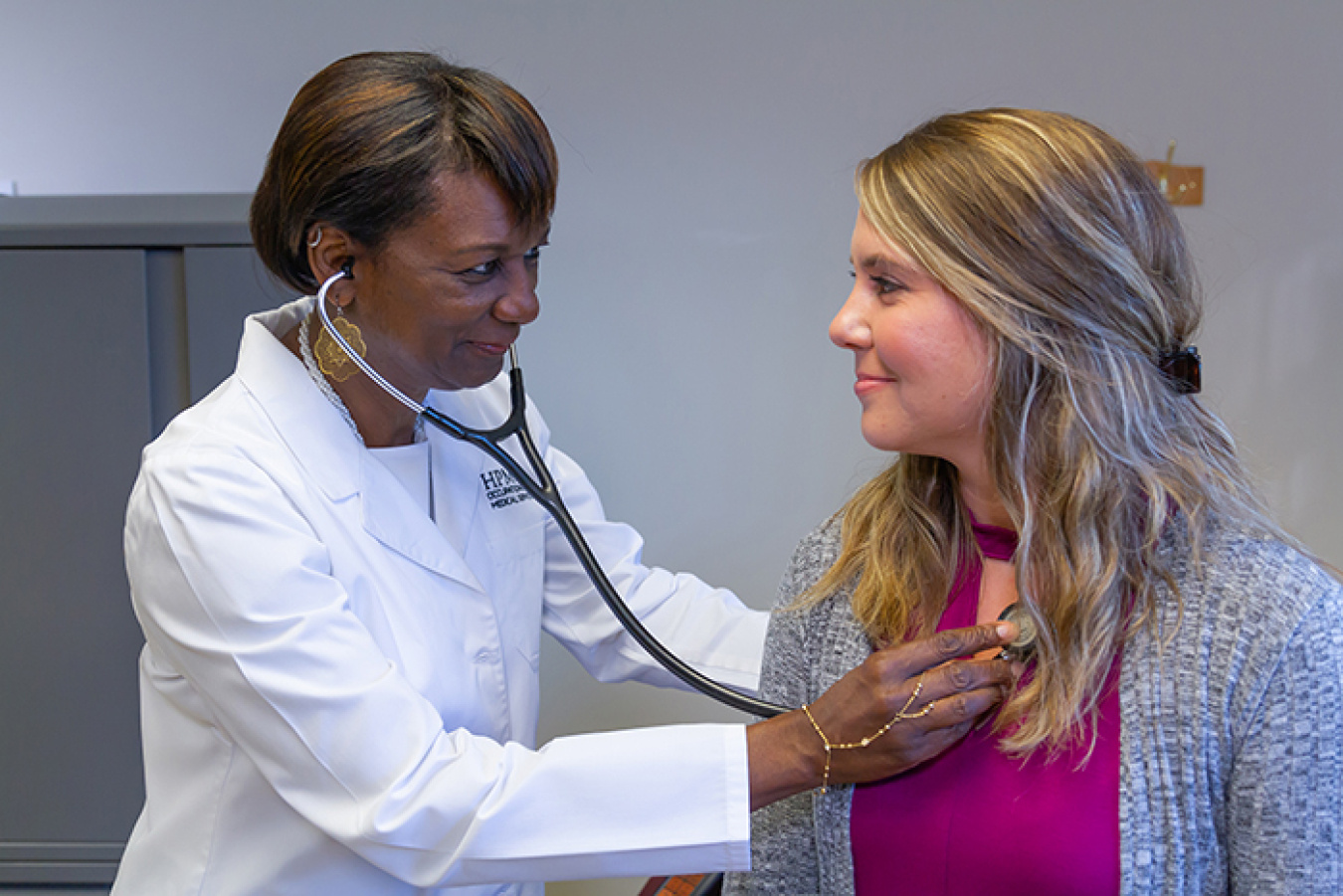 HPM Corporation Clinical Director Dr. Denise Algood, who directs daily clinical operations for the Hanford Site, examines a Hanford worker.