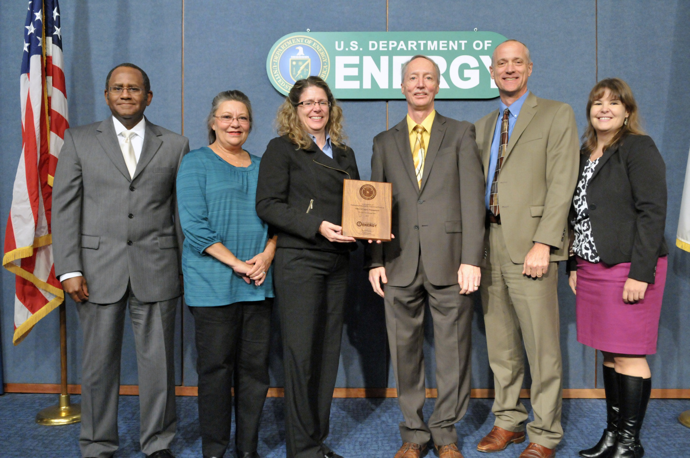 Award ceremony: Melvin G. Williams, Jr., Associate Deputy Secretary, DOE; Mary Sizemore, EMS Coordinator, LM contractor; Tracy Ribeiro, EMS Coordinator, LM; Tom Pauling, Dir. of Site Operations, LM; Dave Geiser, Director, LM; and Jennifer MacDonald, Direc