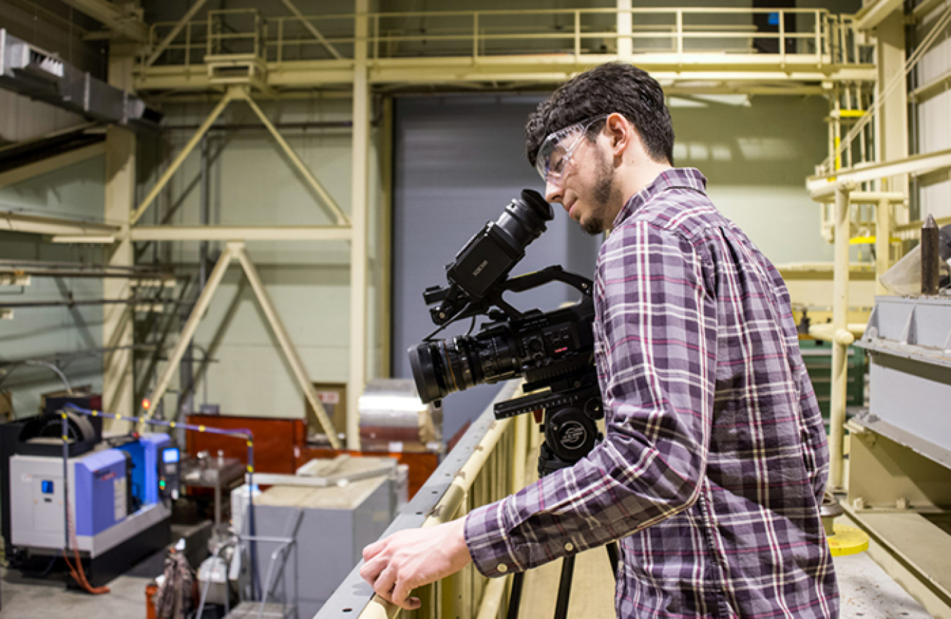 High school senior Micah Gilbert works on his skills as a videographer during Job Shadow Day at DOE's Savannah River Site (SRS). Dozens of local students visit SRS each year to explore a potential career.