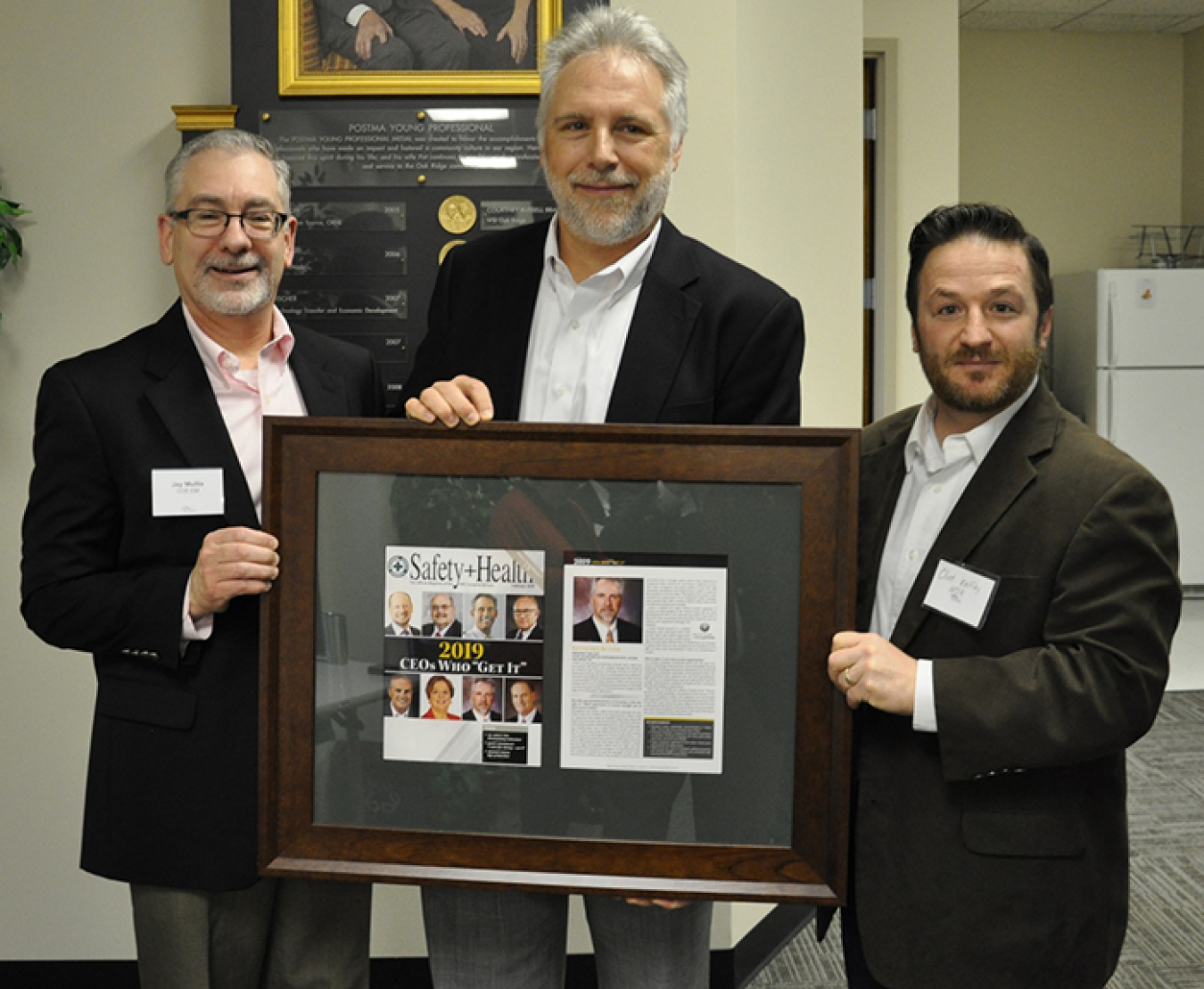 Oak Ridge Office of Environmental Management Manager Jay Mullis, left, and UCOR Environment, Safety and Health and Quality Assurance Manager Clint Wolfley, right, recognize UCOR President and CEO Ken Rueter for being named a 2019 CEO Who “Gets It” by the