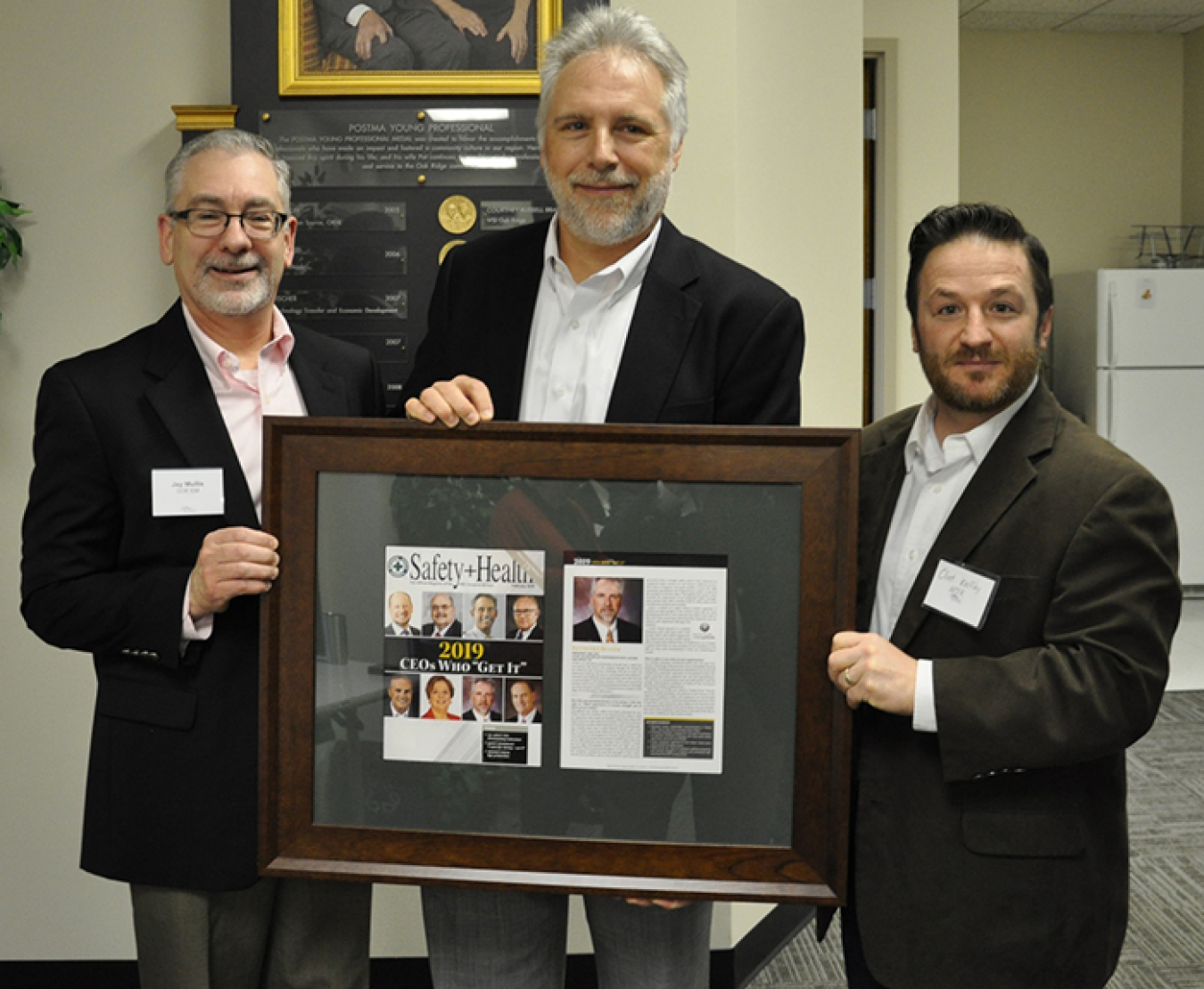 Oak Ridge Office of Environmental Management Manager Jay Mullis, left, and UCOR Environment, Safety and Health and Quality Assurance Manager Clint Wolfley, right, recognize UCOR President and CEO Ken Rueter for being named a 2019 CEO Who “Gets It” by the 