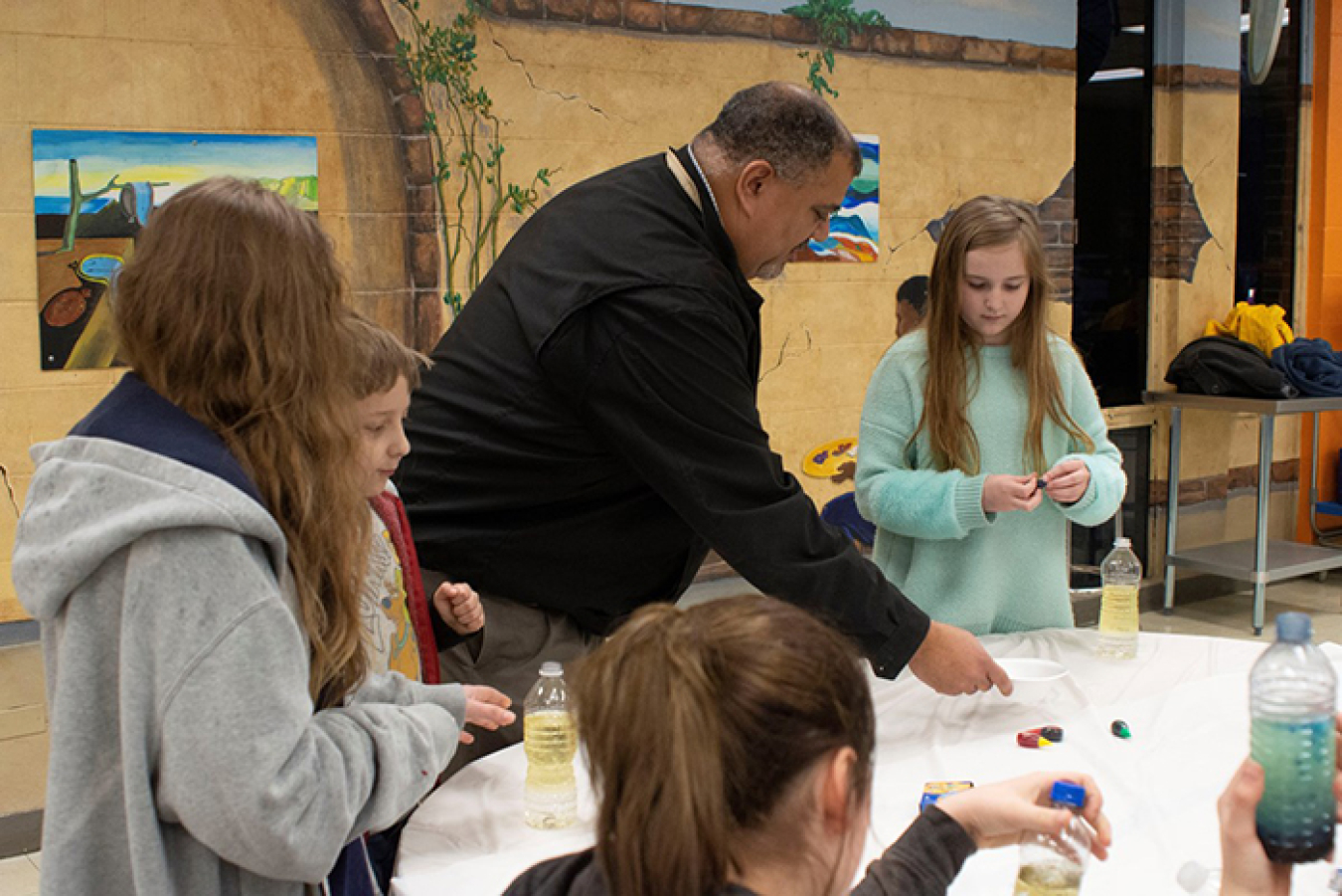 The Oak Ridge Office of Environmental Management’s Leon Duquella shows students how to build lava lamps.