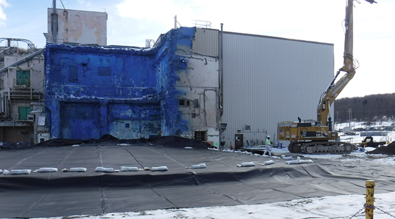 The Vitrification Facility demolition area after installation of the cover. The Main Plant, which is in the process of being deactivated, is in the background.
