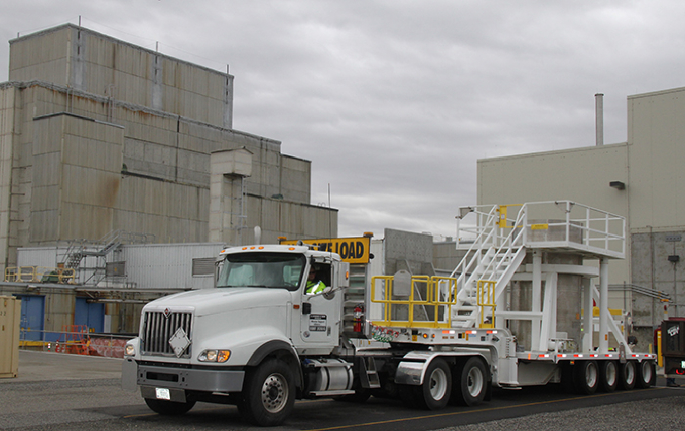 An engineered container filled with radioactive sludge is prepared for transport from the 105-K West Annex to safer storage in the central part of the Hanford Site. Sludge removal from the basin is expected to be complete by the end of the year, reducing 