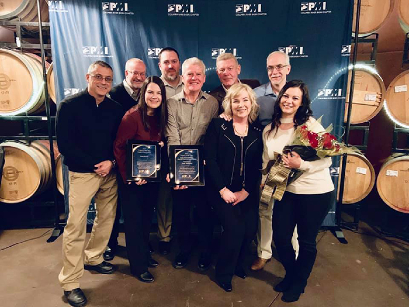 Employees with CH2M HILL Plateau Remediation Company hold the awards they received from the Columbia River Basin Chapter of the Project Management Institute. From left, Jeff Broussard, Dan Wood, Ketra Evans, Matt St Germaine, Neal Sullivan, Ty Blackford, 