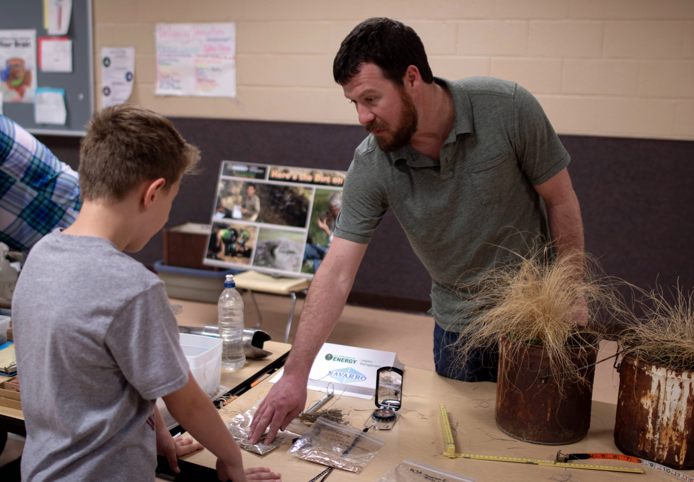 Botanist David Holbrook showed students the tools used to measure large spaces like pastures.