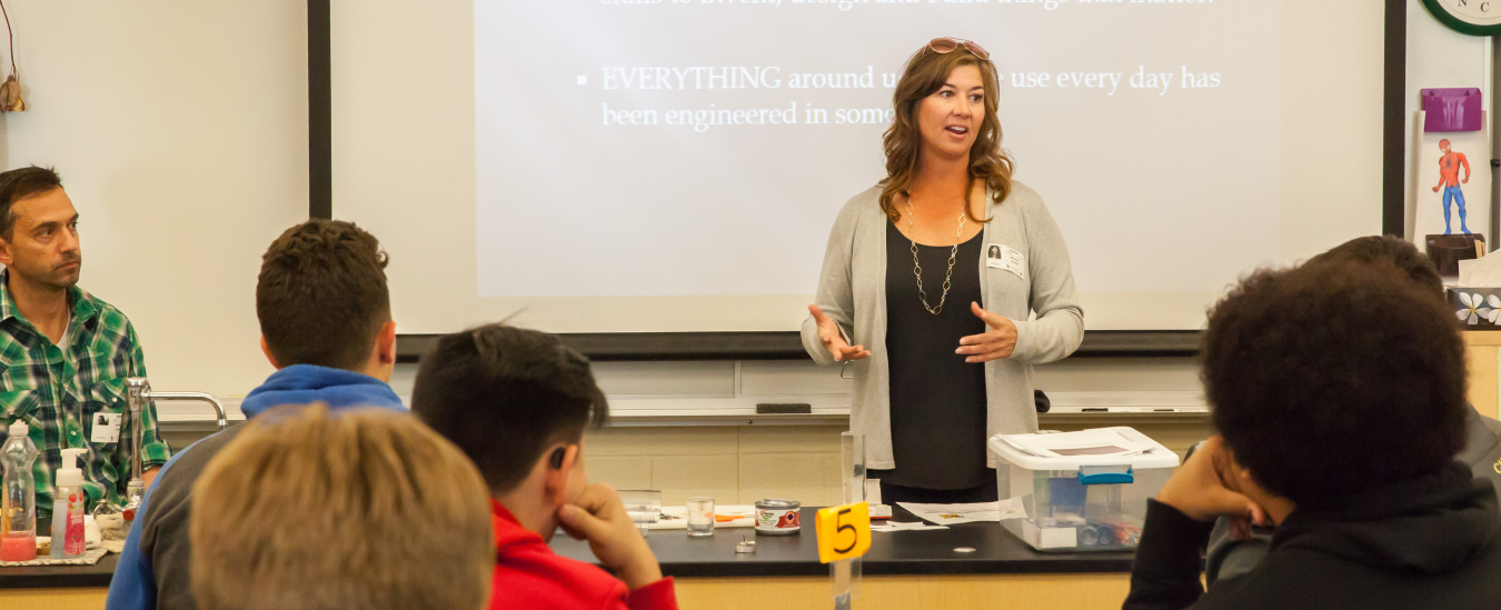 Nuclear Waste Partnership Fire Marshal Brenda Larsen discusses fire protection engineering at Hobbs Freshman School in Hobbs, New Mexico during Engineers Week.