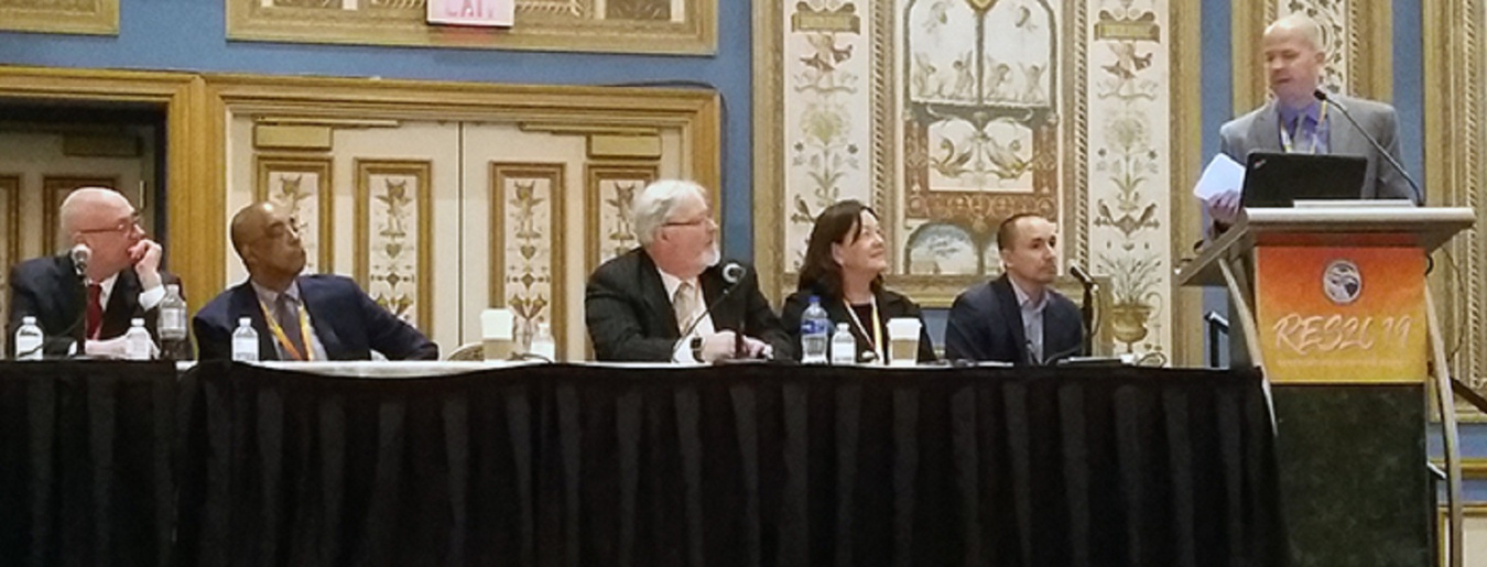 EM Consolidated Business Center Acquisition Integration Lead Aaron Deckard discusses future EM contracting opportunities during a panel session at the Reservation Economic Summit 2019. Other panelists included, from left, Charlie Smith, director of the DO