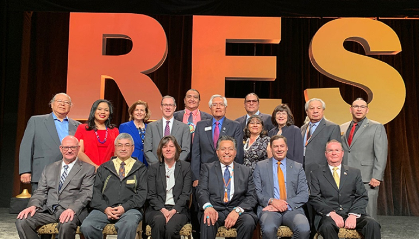 EM Assistant Secretary Anne White, front row, center, joins other DOE officials and members of the National Center for American Indian Enterprise Development Board of Directors at the Reservation Economic Summit 2019. Chris James, the center’s president a