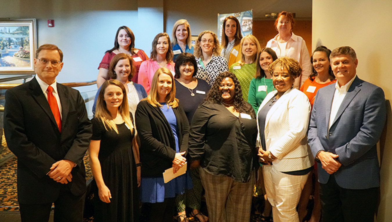 Savannah River Remediation (SRR) President and Project Manager Tom Foster, far right, and SRR Chief Operating Officer and Deputy Project Manager Mark Schmitz, far left, awarded grants to area elementary school teachers (pictured) at a recent reception.