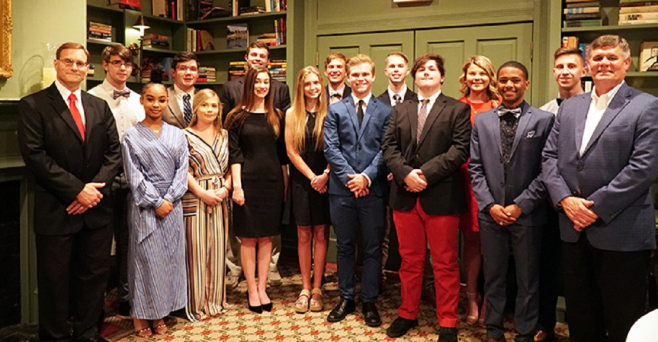 Savannah River Remediation (SRR) President and Project Manager Tom Foster, far right, and SRR Chief Operating Officer and Deputy Project Manager Mark Schmitz, far left, presented scholarships of $3,000 each to local high school seniors.
