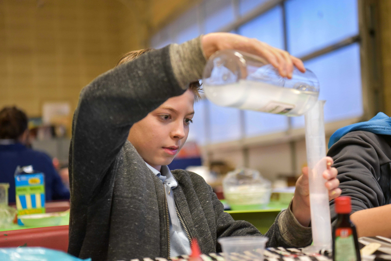 An Albuquerque middle school student enjoys some hands-on science activities as part of Sandia National Laboratories’ Manos program.