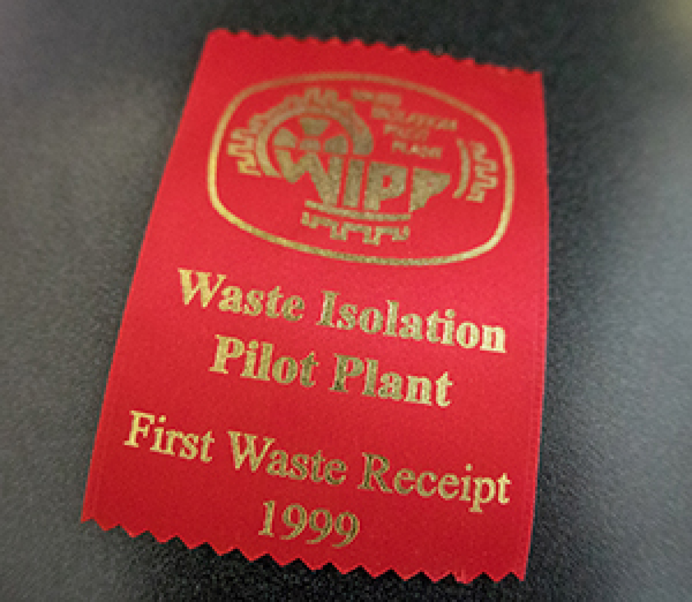 People present for the first transuranic waste shipment to the Waste Isolation Pilot Plant on March 26, 1999 received a ribbon marking the occasion. 