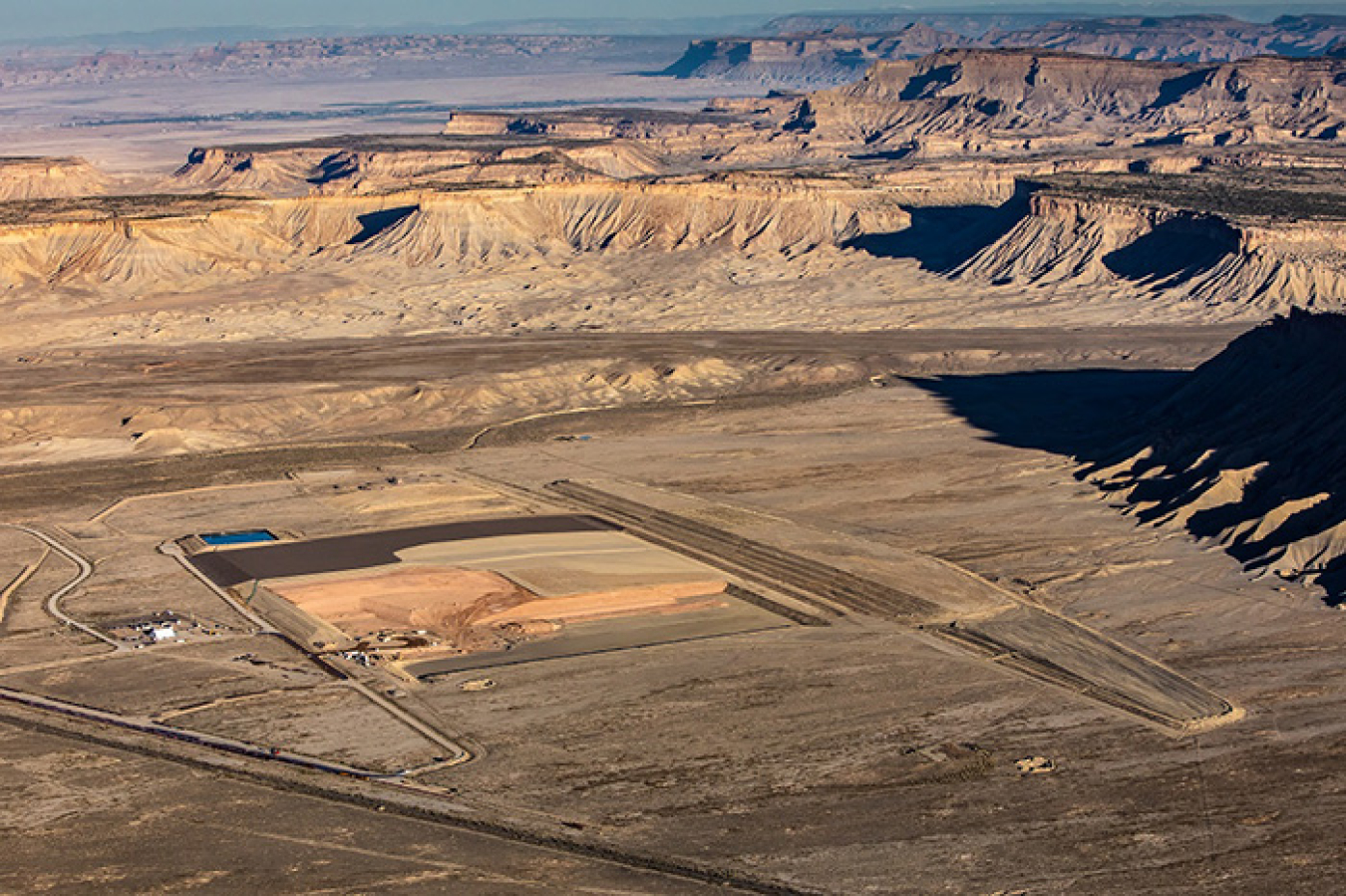 Containers loaded with mill tailings at the Moab Site are shipped by train about 30 miles north to the Crescent Junction disposal cell.