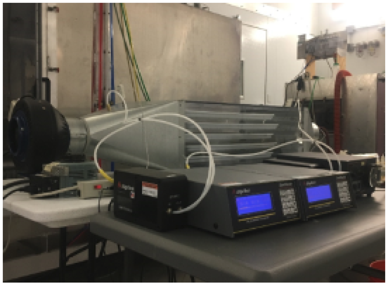 ORNL bench-top air handler with liquid desiccant flowing in three trays.