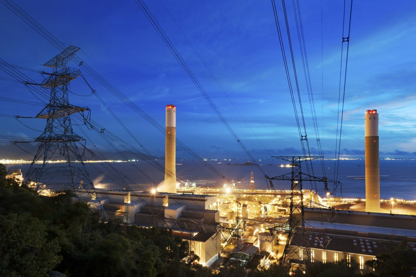 An electrical power plant at night.