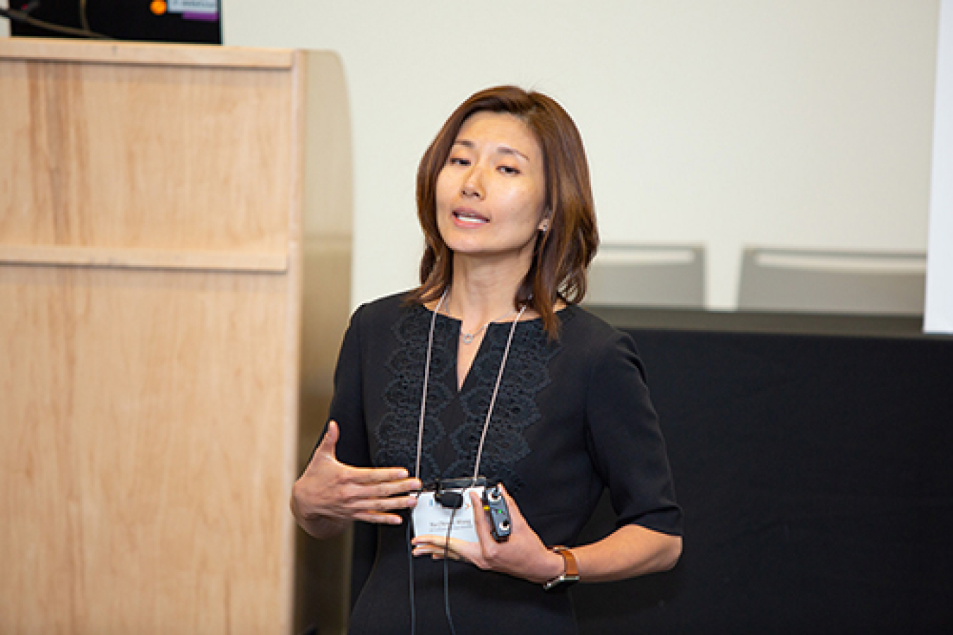 Woman speaking at a conference.