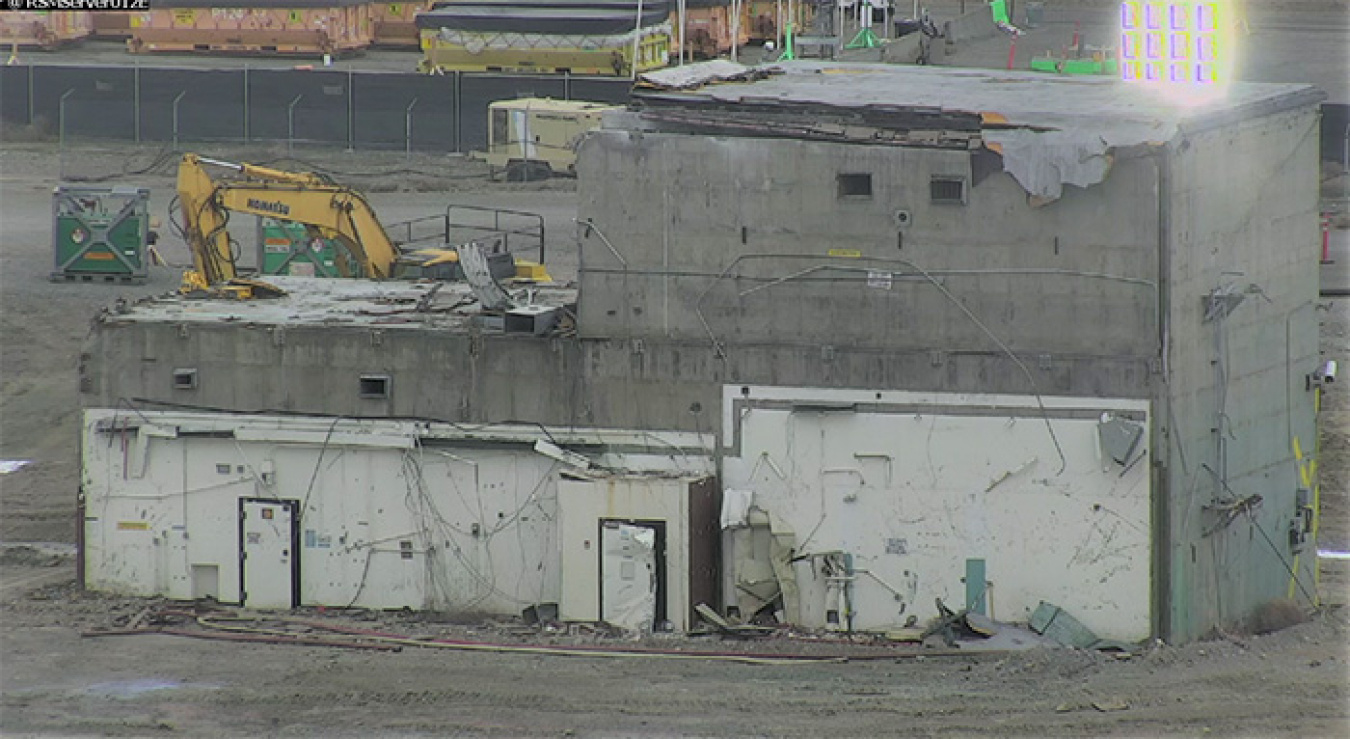 Before-and-after photos show how workers safely removed a concrete vault associated with the Plutonium Finishing Plant’s Main Processing Facility. Demolition began in April and was completed in mid-May.