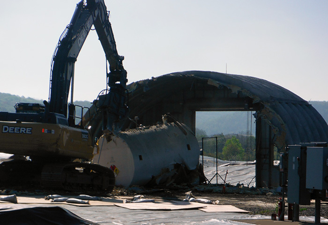 A crew tears down the liquid pretreatment system structure. 