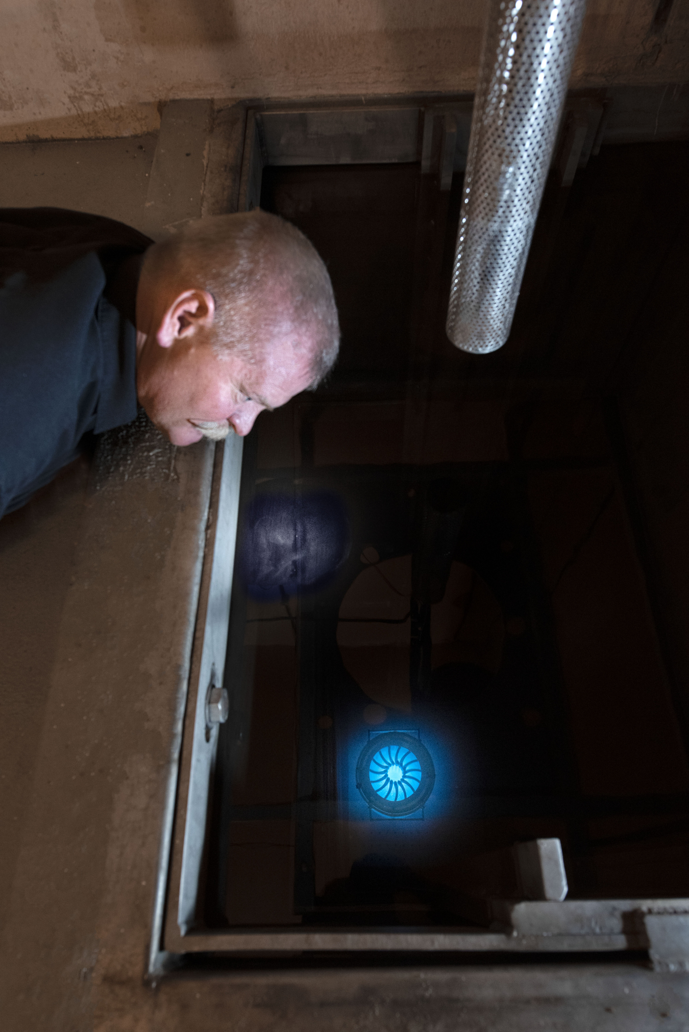 Technologist Don Hanson looks down at the shutter assembly of the Gamma Irradiation Facility at Sandia National Laboratories