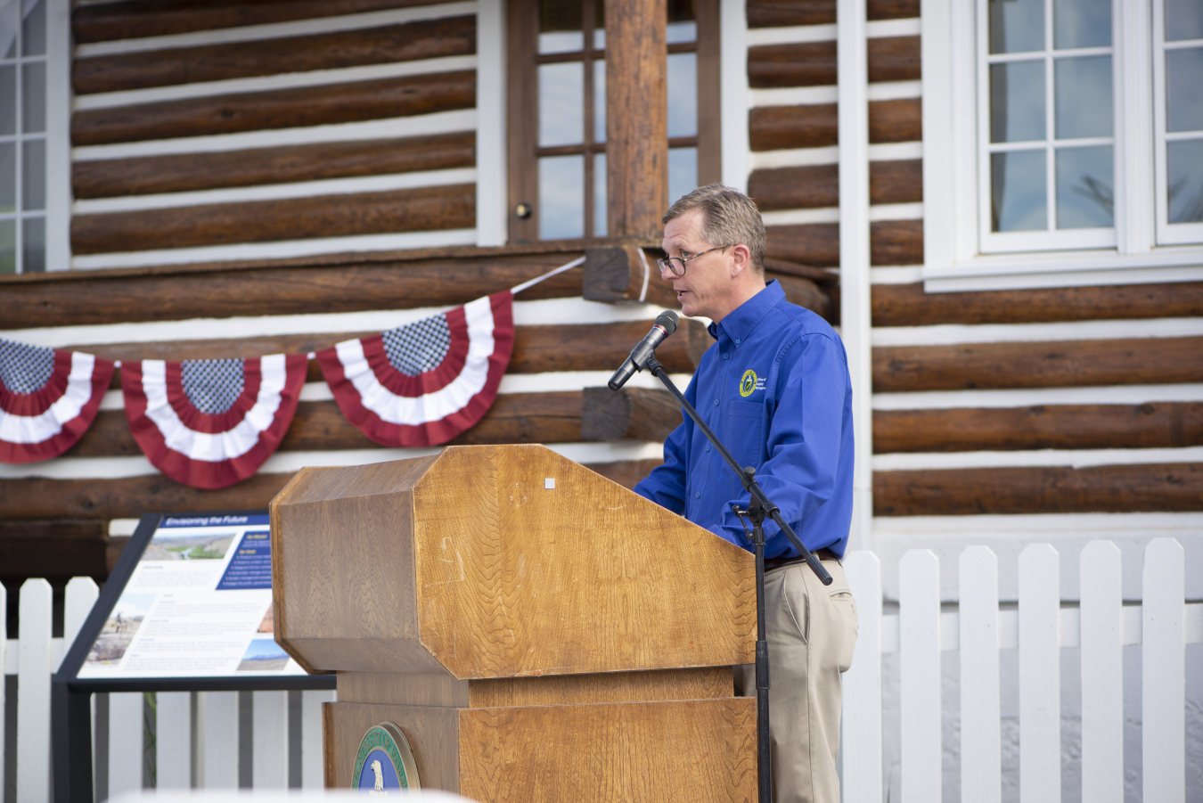 Padraic Benson emcees the opening ceremony of the Atomic Legacy Cabin.