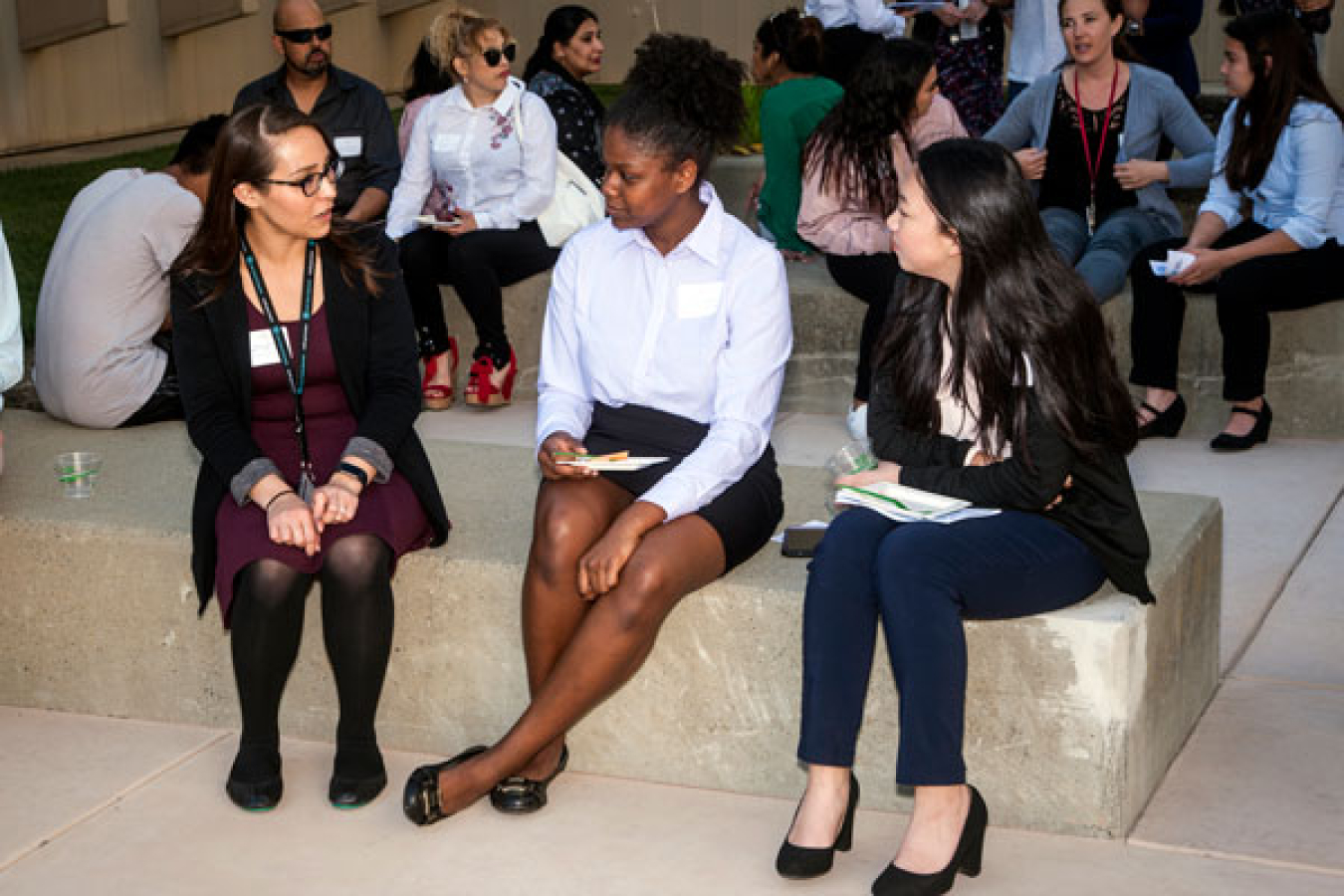 Sandia Women’s Connection host Lindsay Dugan (left) visits with award recipients prior to the ceremony at Sandia/California. The young women are paired with Sandia female mentors