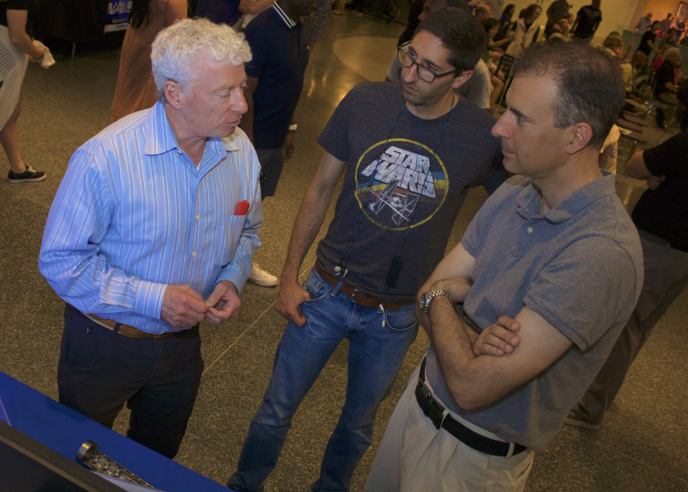 Dr. Willy Moss of Lawrence Livermore National Laboratory explaining his lab's technologies to museumgoers at Miltary Invention Day at the National Museum of American History.