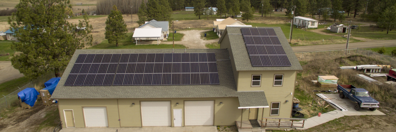 Photo of a Spokane Tribe house with solar panels on the roof.