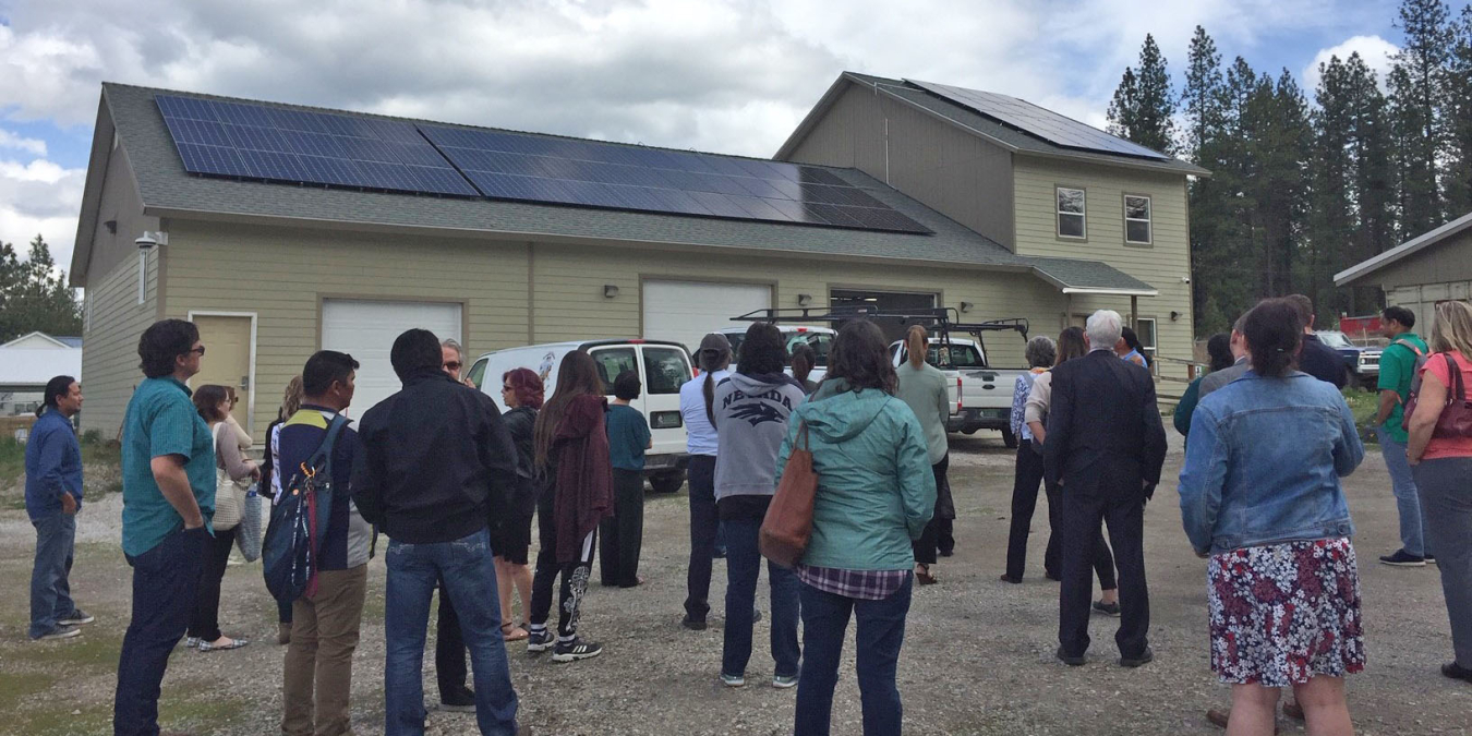 People take a tour to see the solar panel installation.