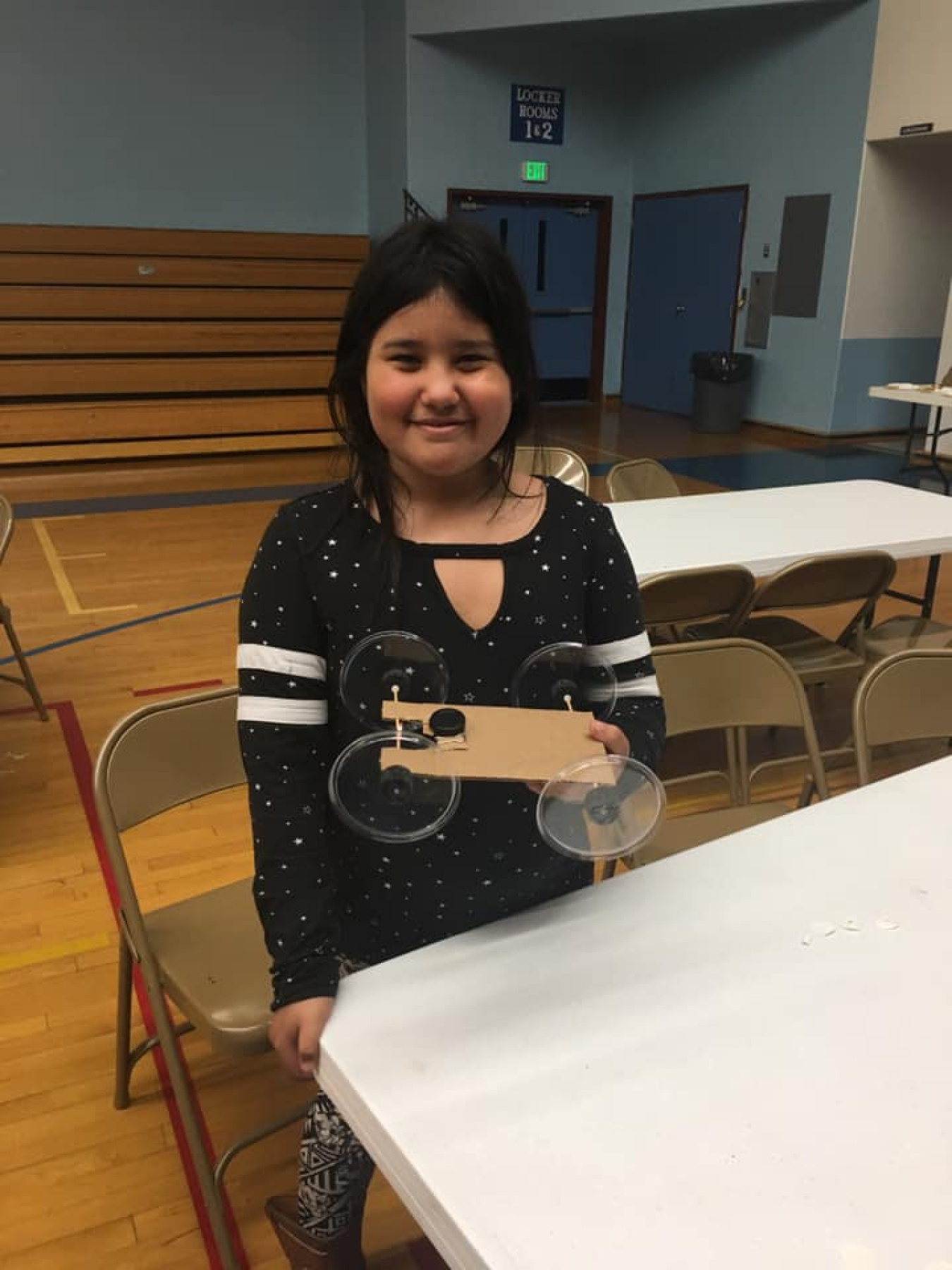 Older students at Lapwai Elementary School’s family STEM night built cars with retractable badge clip “motors.”