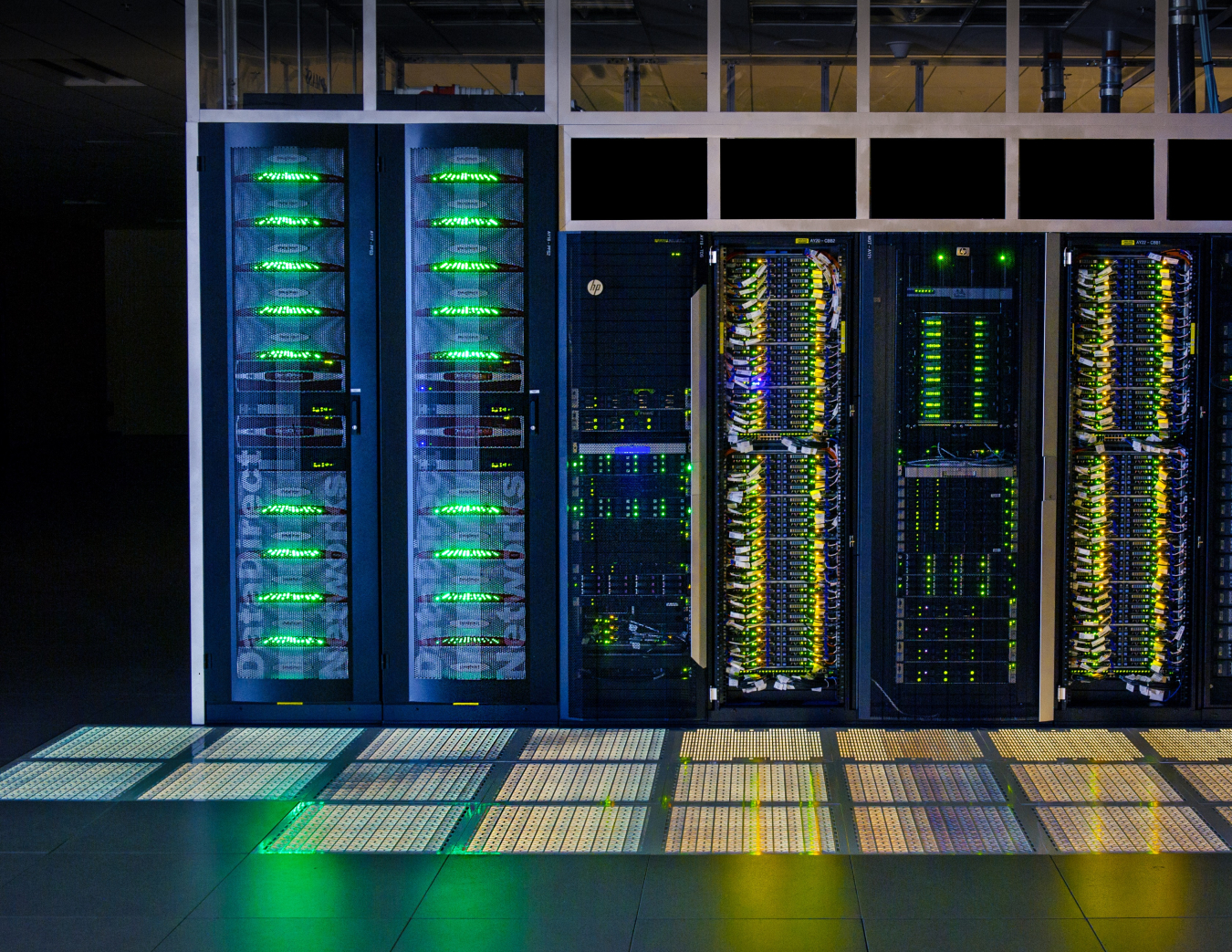 Interior of supercomputer with blue, green and yellow light diodes.