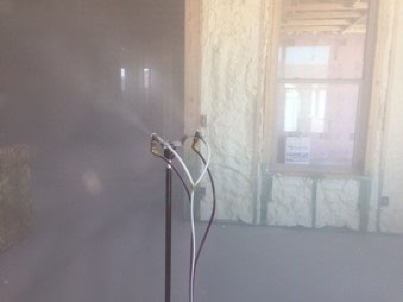 Photo of an aerosol spray in a building.