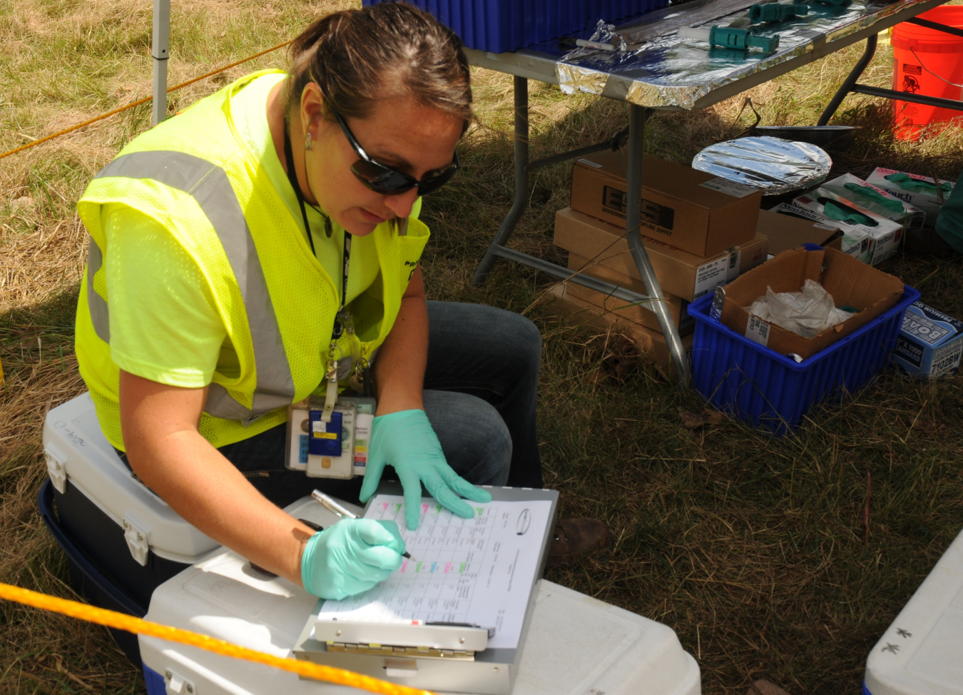 A technician enters environmental media data into report records as part of DOE's Portsmouth Environmental Monitoring program.