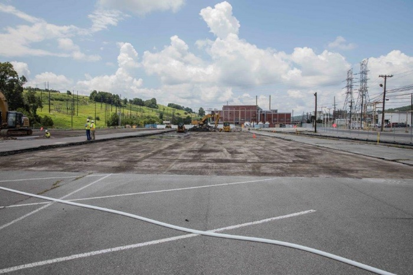 Workers remove asphalt on the east end of the Y-12 National Security Complex for the site of the Mercury Treatment Facility’s treatment plant.