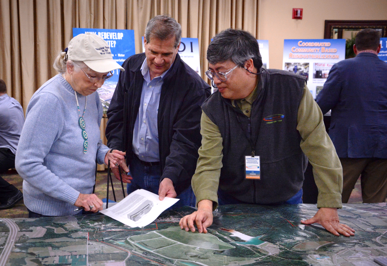 A DOE contractor discusses the Portsmouth On-Site Waste Disposal Facility with local residents during a community Open House event. 