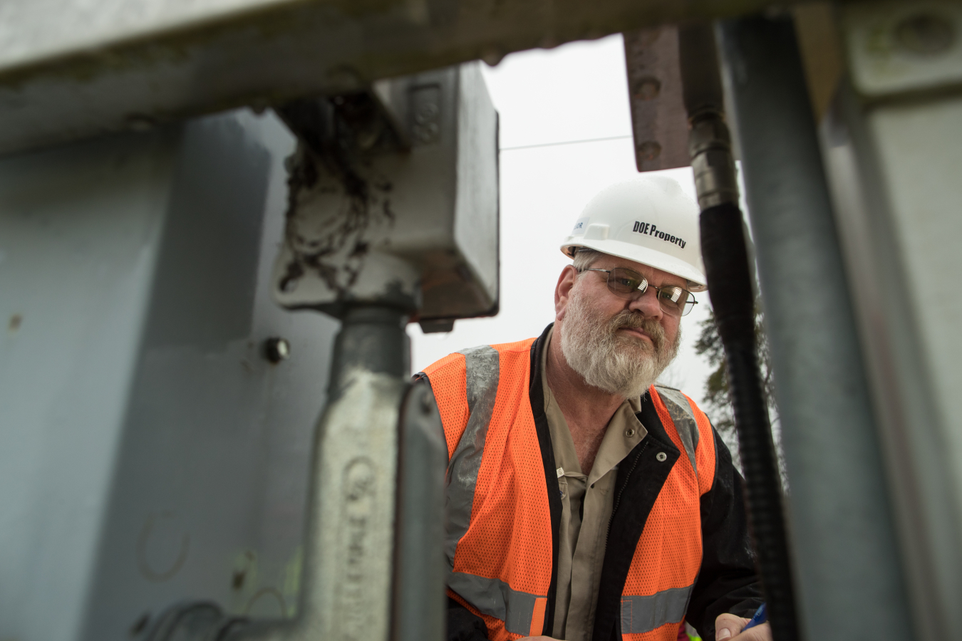 A technician checks air-monitoring equipment at the Portsmouth Site.