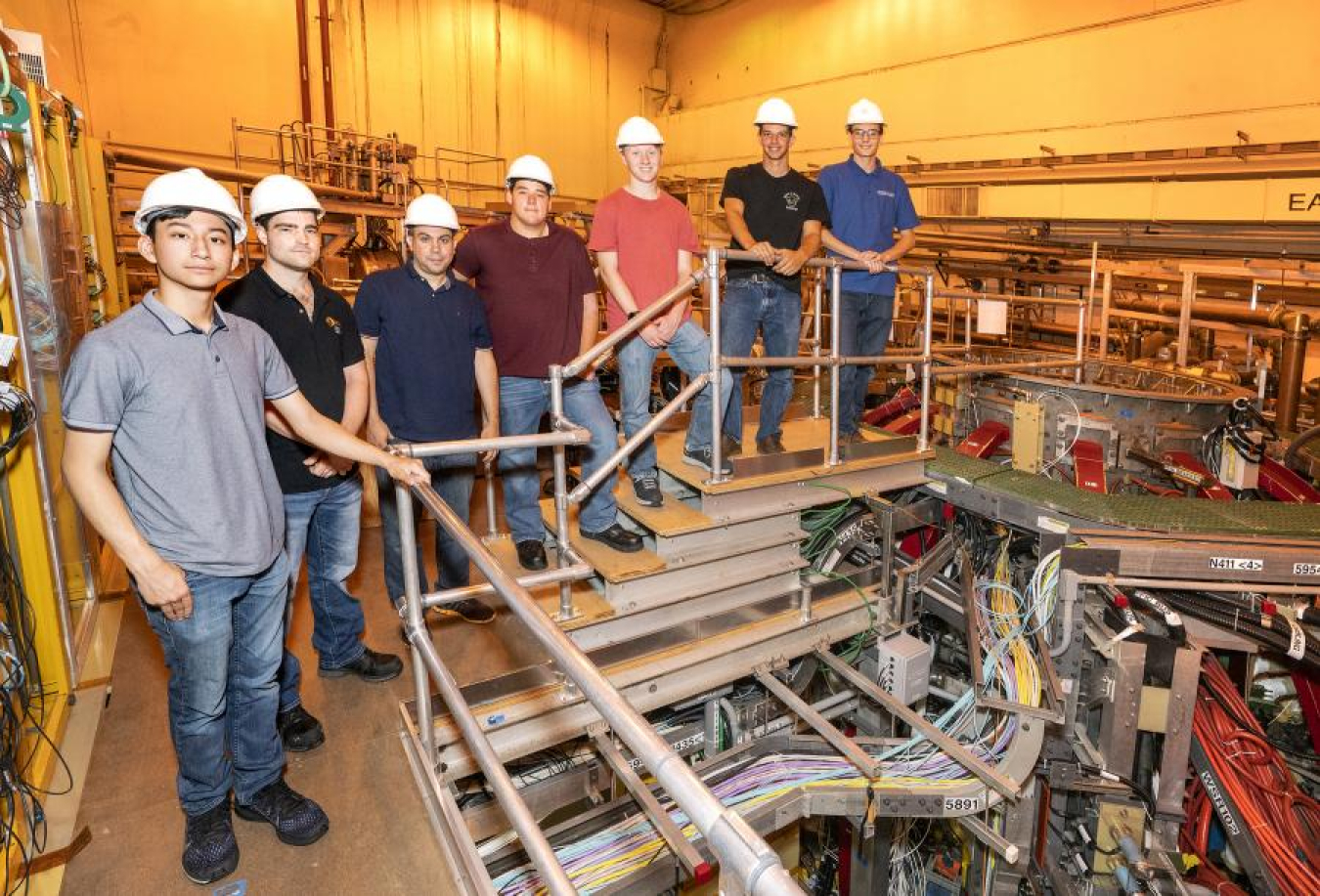 Pre-apprentices in the National Spherical Torus Experiment-Upgrade test cell. L-R: Brian Rivera, East Windsor; Purdy; Nelson Espinal, NY; Robert Bongiovanni, Hamilton; Aaron Floyd, Lawrenceville; Cole Widman, Hopewell Township, Sheehan Twomey, Princeton.