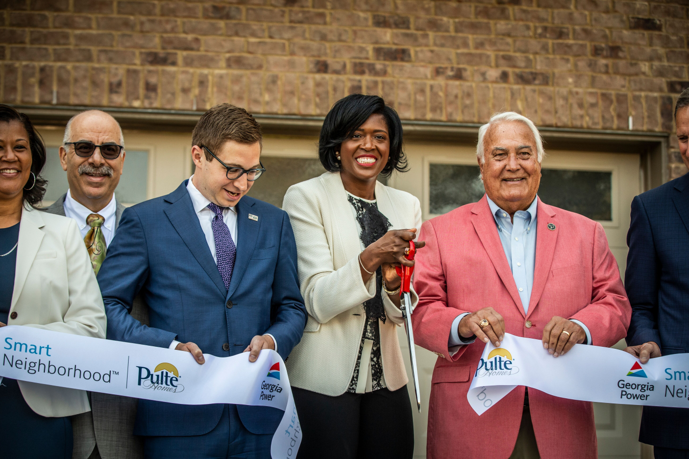 Acting Deputy Assistant Secretary for Energy Efficiency, Alexander Fitzsimmons (center-left), cuts the ribbon with Georgia Power Smart Neighborhood stakeholders.