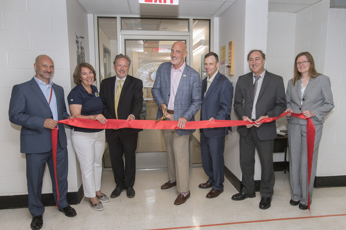 NNSA Associate Administrator and Deputy Under Secretary for Counterterrorism and Counterproliferation Jay Tilden cuts the ribbon for the renovated RAP 1 facility at Brookhaven National Laboratory in Brookhaven, New York.