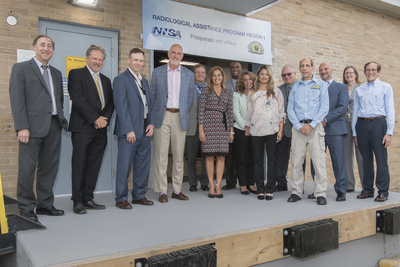 RAP 1 ribbon cutting ceremony participants pose outside the facility at Brookhaven National Laboratory.