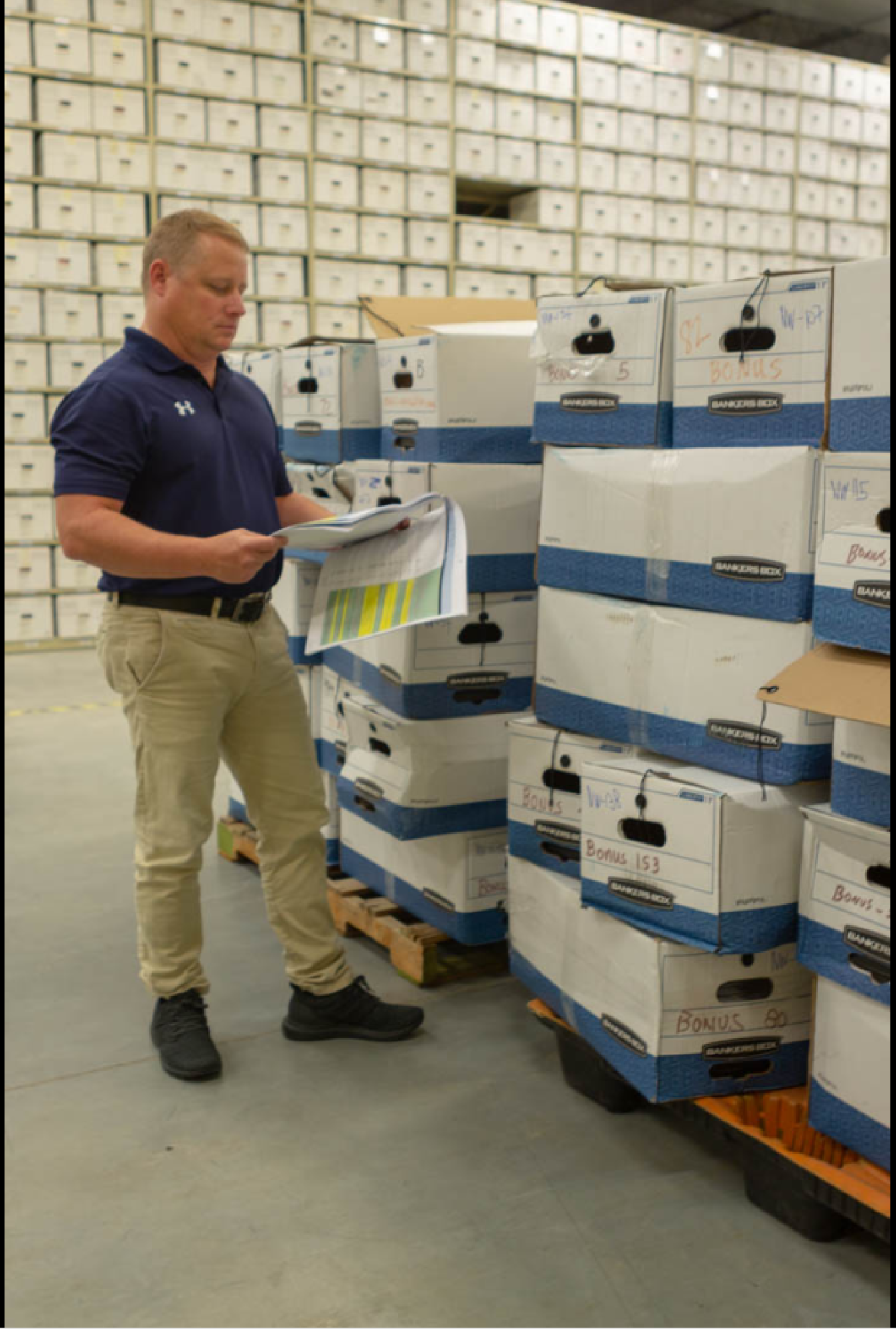 Cliff Carpenter, BONUS LM Site Manager, reviews catalogued records at the Legacy Management Business Center.