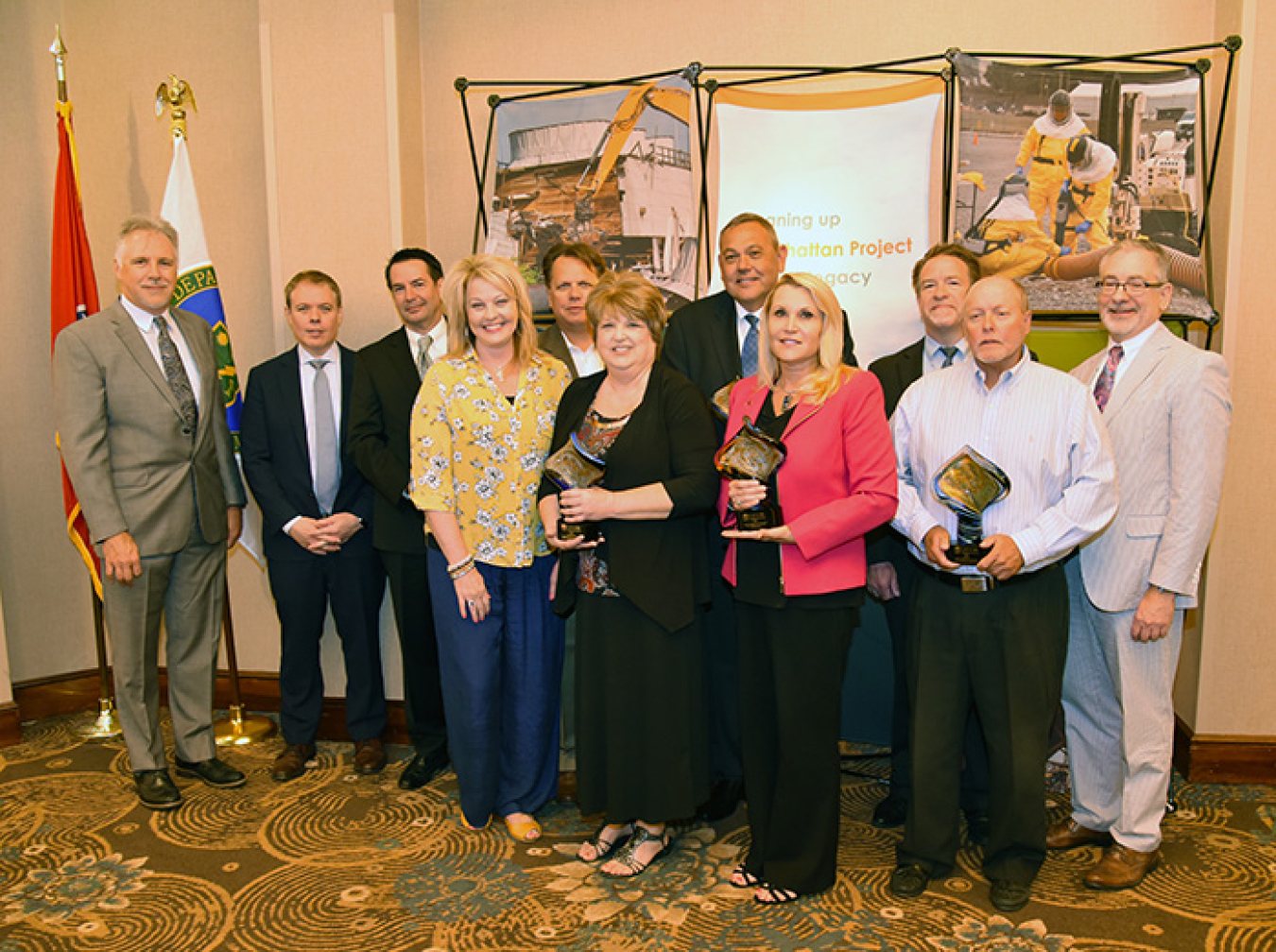 UCOR President and CEO Ken Rueter, far left, and EM’s Ike White, second from left, join representatives of the UCOR Small Business Award winners.