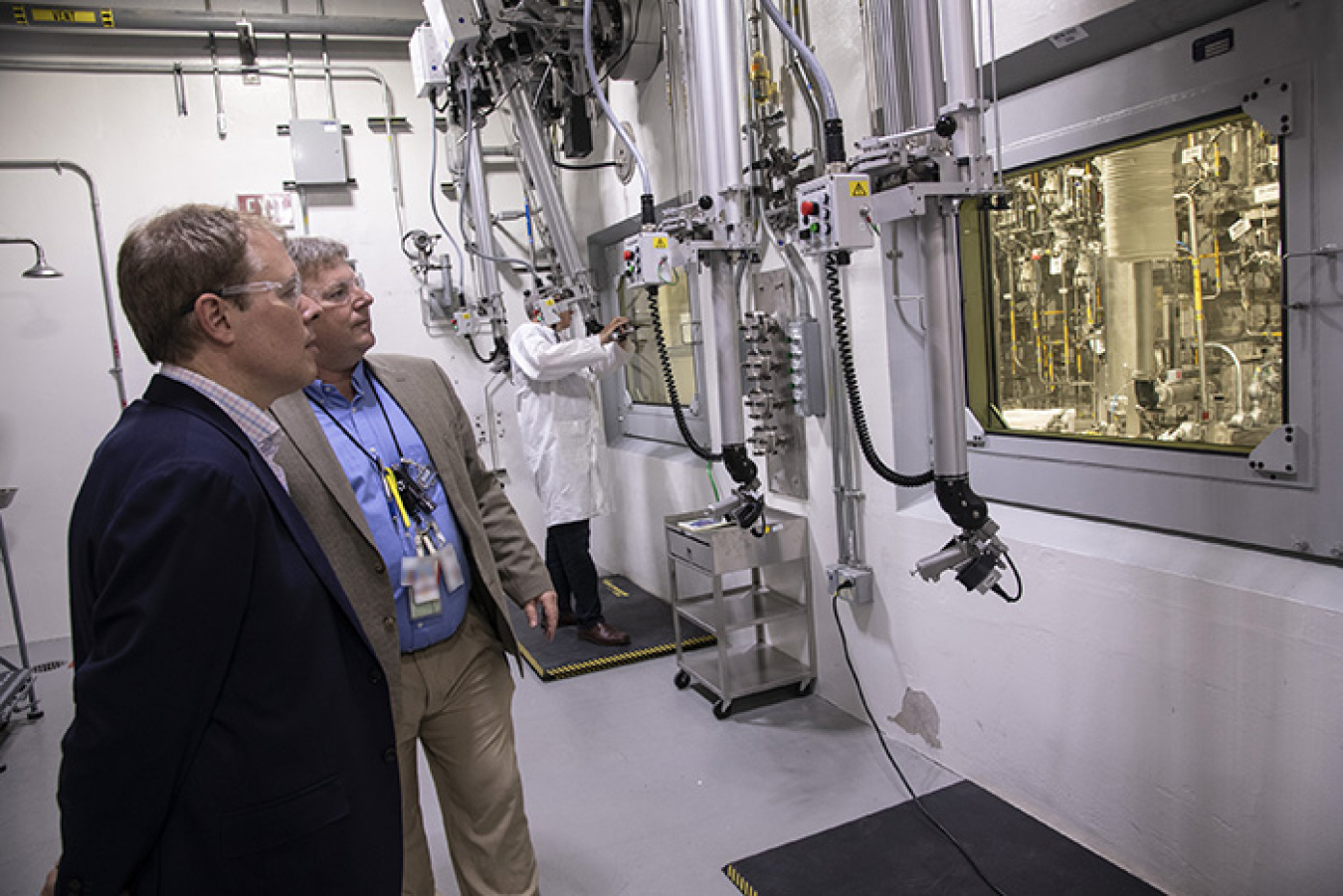 Ike White, left, Senior Advisor for EM, tours the Salt Waste Processing Facility (SWPF) with Cliff Conner, cognizant system engineer and process manager for Parsons, EM’s SWPF contractor at the Savannah River Site.
