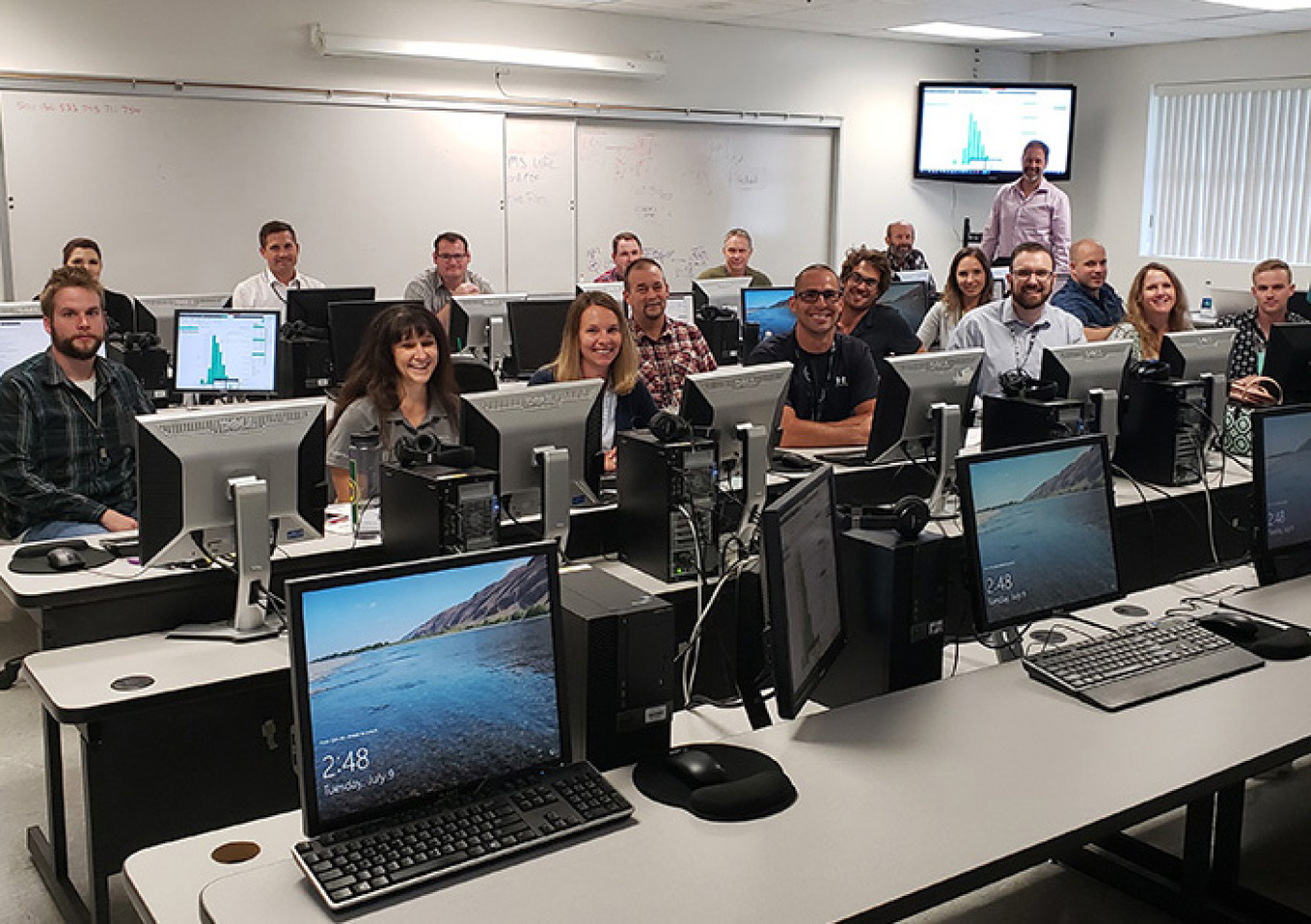 EM and Hanford Site contractors pose for a photograph while training on a new piece of software designed to standardize risk assessments across the site.