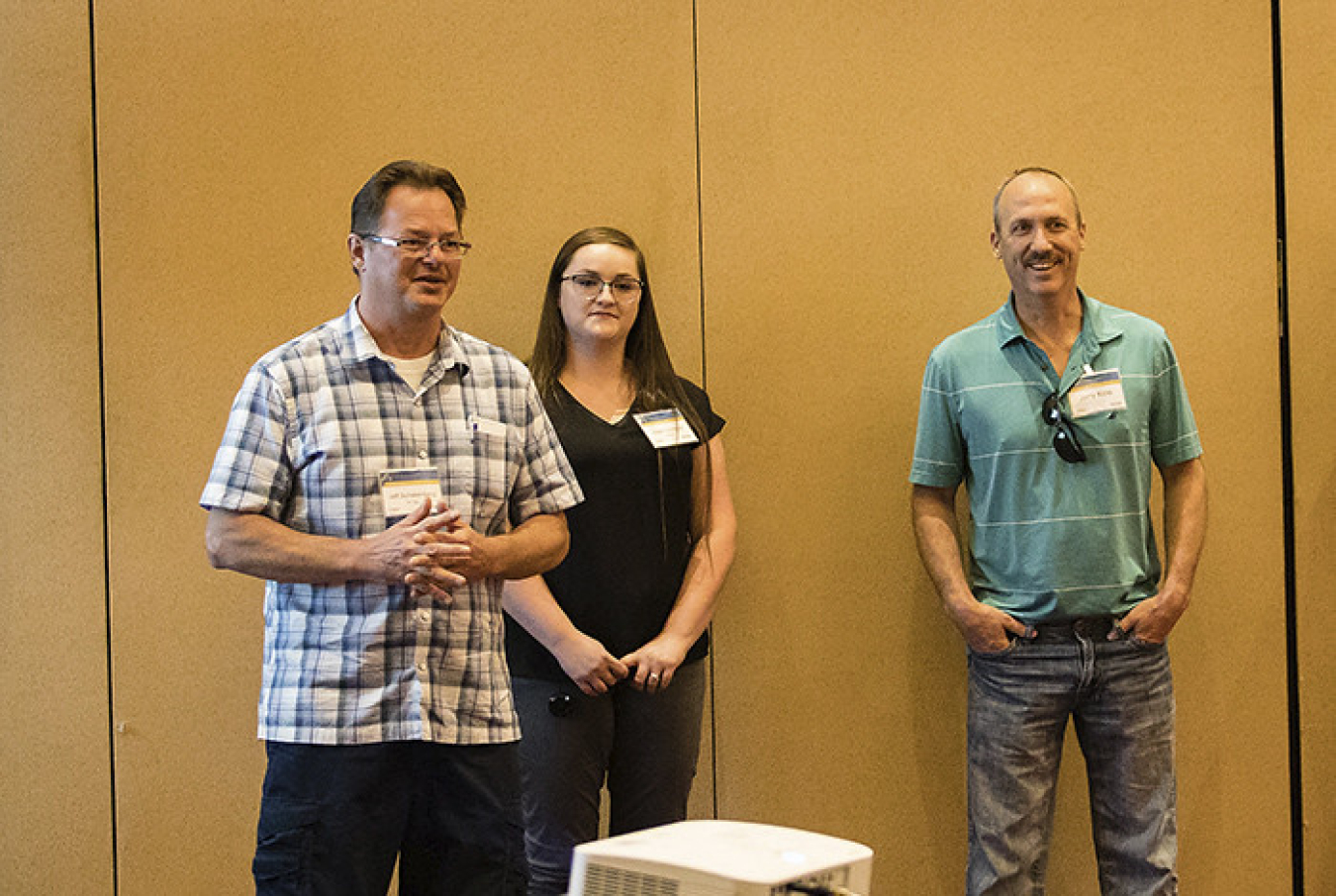 Employees from Los Alamos National Laboratory talk to candidates about life at the Laboratory during the hiring event August 28.