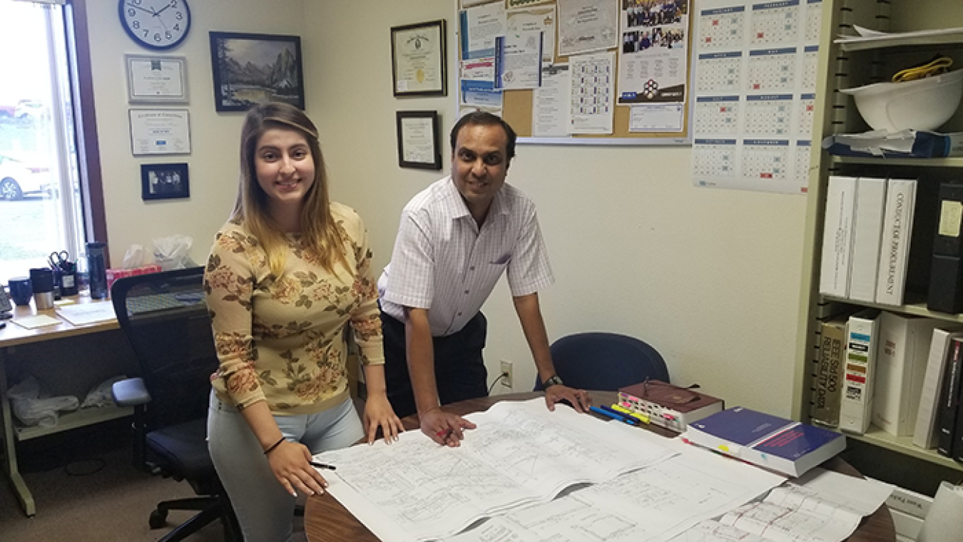 Norma Aguilera-Vazquez left, shown with her mentor, Dharmendra Rana, participated in the Mission Support Alliance co-op internship program before being hired as a full-time civil engineer in the spring.