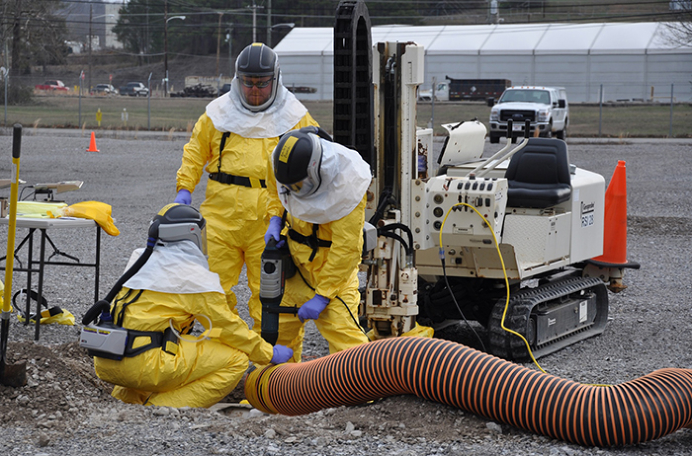 Workers extract soil samples from Oak Ridge’s East Tennessee Technology Park at depths up to 30 feet in the ground.